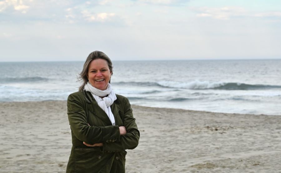 Anette Freytag standing on beach with waves in background